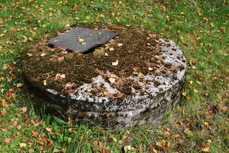 typical concrete water well with moss, horizontal