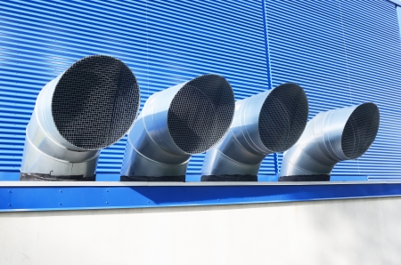 four ventilation pipes of industrial building, horizontalの写真素材