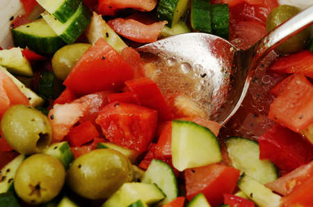 fresh summery salad of fresh olives, red peppers and tomatosの写真素材