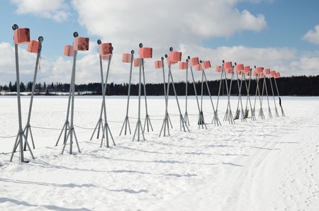 empty boat park on the lake in winter under the snowの写真素材