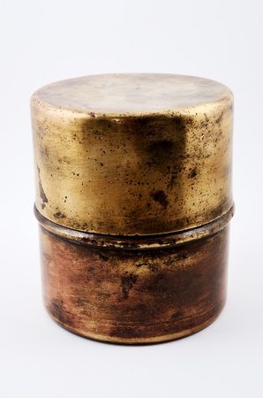 old copper pot with a patina on a white backgroundの写真素材