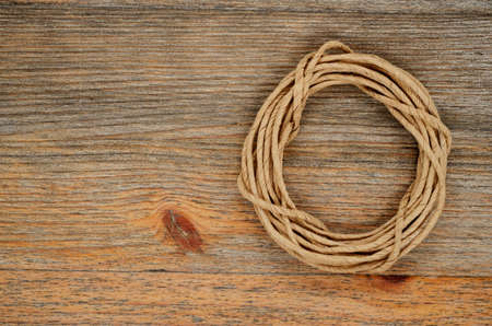 oval hank of packthread over wooden backgroundの写真素材