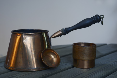 set of copper cookware coffee on the wooden tableの写真素材