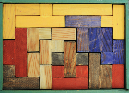 old wooden multicolored puzzle in rectangular box