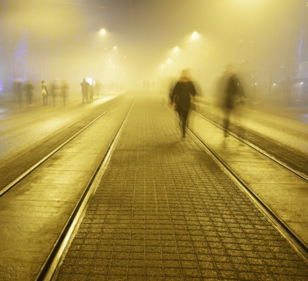 walk along the pavement on the night street in Helsinki, Finland