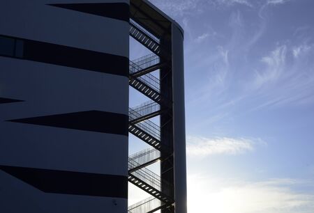metal fire escape on a background of blue sky