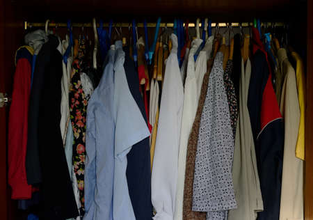 a lot of old different clothes in the wardrobeの写真素材