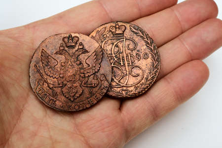 two old Russian copper coins of the 18th century in the palm