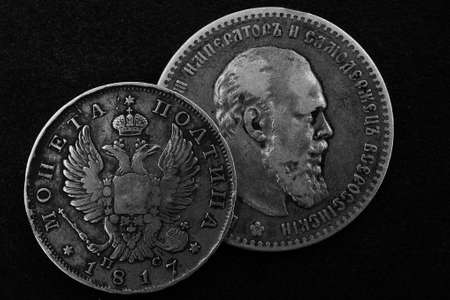 two old Russian silver coins of the 18th century on dark backgroundの写真素材