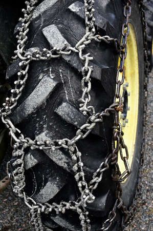 wheel chains on the big wheel of the tractor