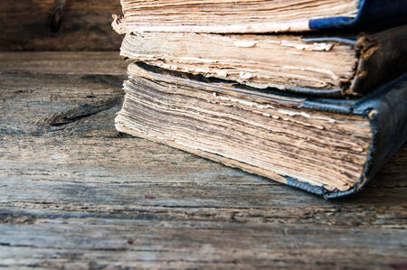 old books on a wooden backgroundの写真素材