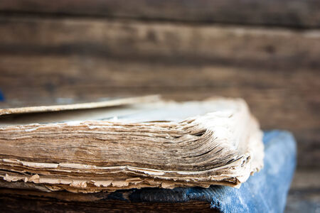 old books on a wooden backgroundの写真素材