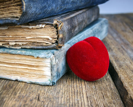 red heart on an old bookの写真素材