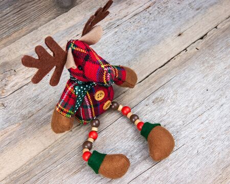 Christmas reindeer toy on wooden backgroundの写真素材