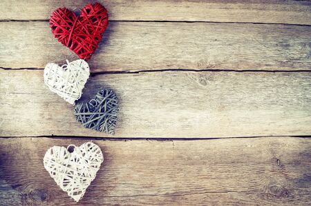 Heart on a wooden background. Vintage style.の写真素材
