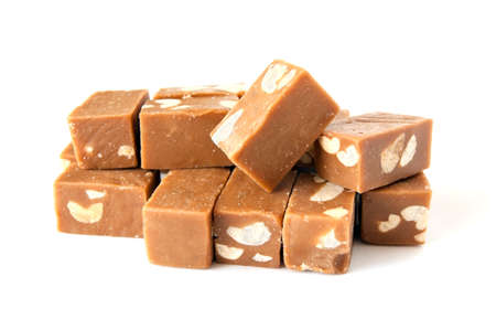 toffee with nuts isolated on white backgroundの写真素材