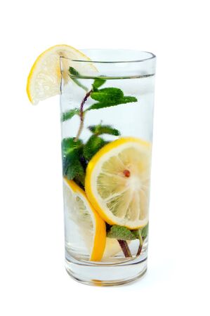Drink with lemon, ice and mint isolated on white backgroundの写真素材
