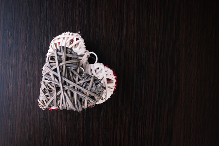Heart on a wooden background. Vintage style.