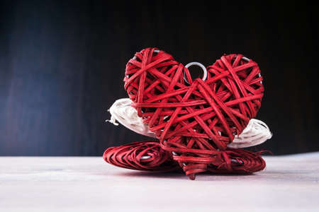 Wooden heart-shaped pattern on the wooden backgroundの写真素材