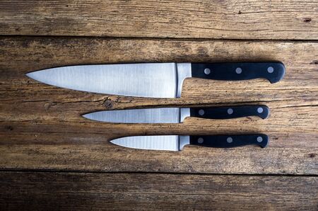 Knife on rustic kitchen table with copy spaceの写真素材