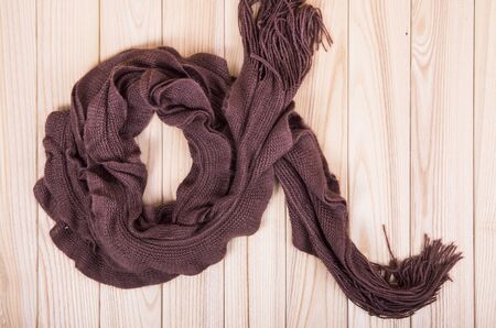 brown scarf on wooden backgroundの写真素材