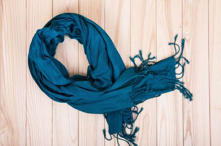 green scarf on wooden backgroundの写真素材