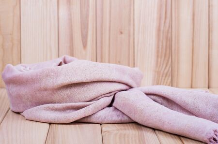pink scarf on wooden backgroundの写真素材