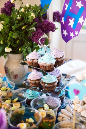 Delicious cupcakes on table on light background