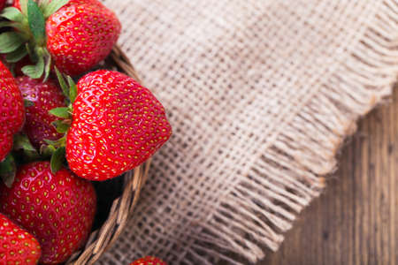 Fresh red strawberries on old wooden backgroundの写真素材