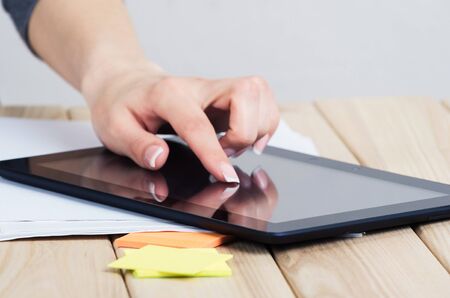 business, education, people and technology concept - close up of female hands pointing finger to...