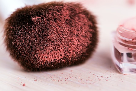 make up brush with red powder . cosmeticsの写真素材