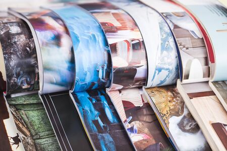 stack of open colorful magazines. informationの写真素材