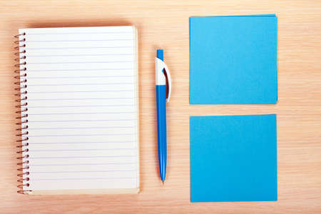pen and paper on wooden backgroundの写真素材