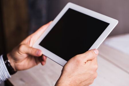 Tablet in male hands