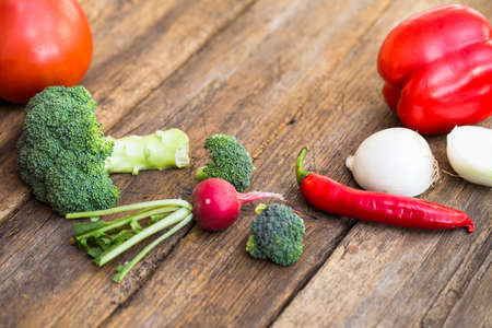 fresh vegetables on a wooden tableの写真素材