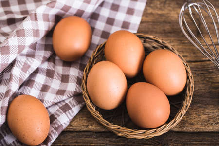 chicken eggs on wooden background