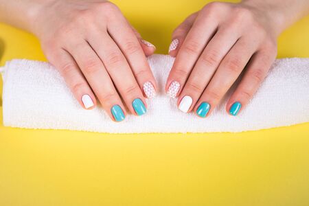 beautiful manicure. gel polish coating in white and turquoise, stamping.