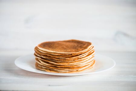 Delicious pancakes on wooden backgroundの写真素材