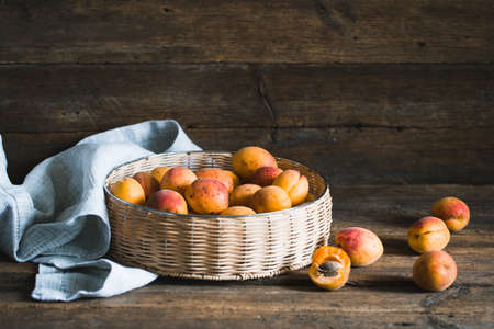 Apricots on a wood background. toning. Vegetarian food. Healthy life.の写真素材