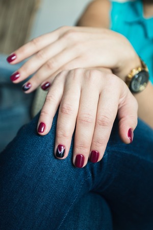 Beautiful woman's nails with beautiful red manicureの写真素材