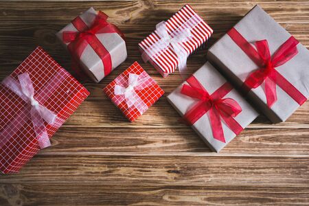 Christmas gift boxes on a wooden backgroundの写真素材
