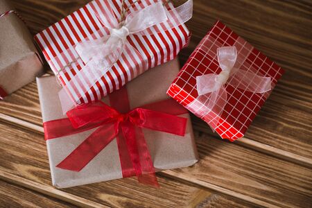 Christmas gift boxes on a wooden background