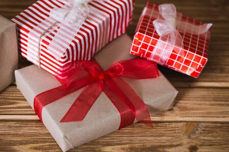 Christmas gift boxes on a wooden backgroundの写真素材