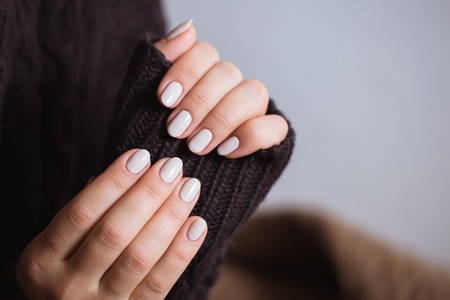 Beautiful woman nails with a beautiful bright manicureの写真素材