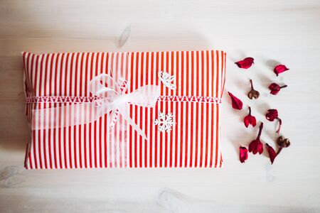 Christmas and New Year gift on white wooden backgroundの写真素材