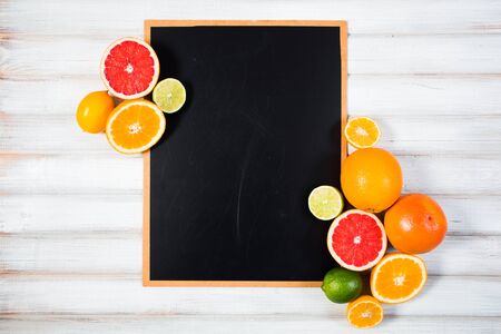 the chalkboard with fresh citrusの写真素材