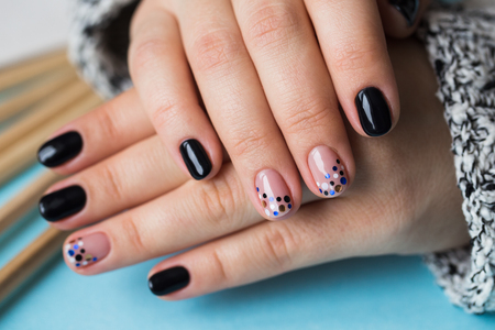 Women's hands with multi-colored pencilsの写真素材