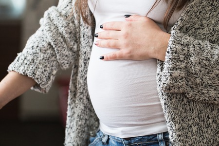 A young pregnant woman, close-upの写真素材