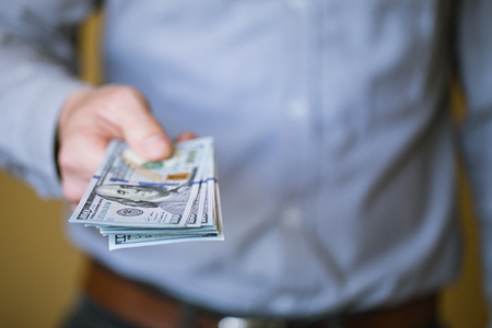 Businessman holding money in his hands