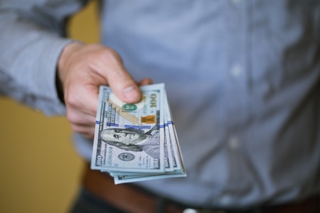 Businessman holding money in his hands
